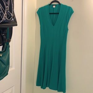 Dress in size 10 Emerald Green flow bottom fitted top very short sleeves 4”